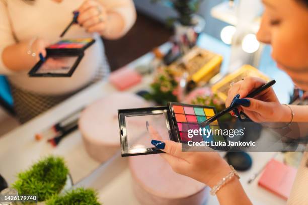 close-up of a colorful makeup palette in front of a mirror - artist palette stock pictures, royalty-free photos & images