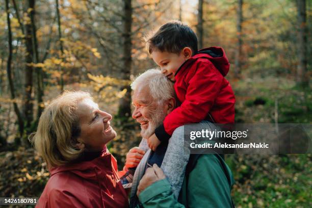 taking our grandson on a hike - grandfather stockfoto's en -beelden