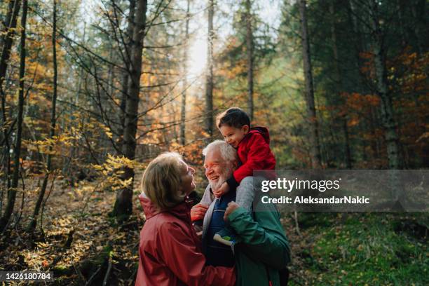 taking our grandson on a hike - grandmother grandfather stock pictures, royalty-free photos & images