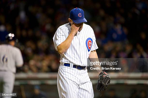Relief pitcher Shawn Camp of the Chicago Cubs walks off the field after giving up two runs to the Milwaukee Brewers during the sixth inning at...