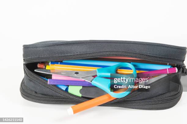 school supplies: pencils, scissors, coloured markers etc. in a pencil case. school supplies. - trousse d'écolier photos et images de collection