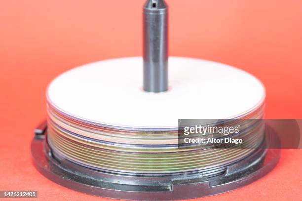 a pile of dvds on red paper. . school supplies. - class rom stock pictures, royalty-free photos & images