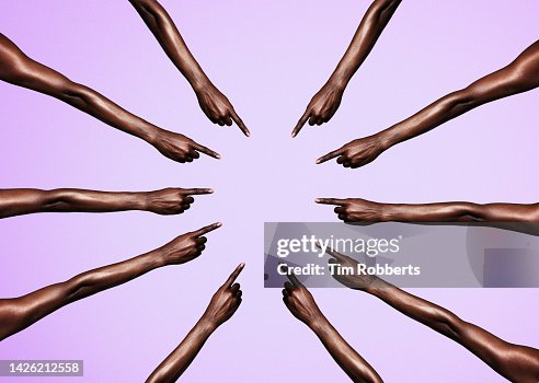 Circle of womans arms pointing Circle of womans arms pointing