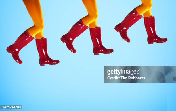 legs with red boots - roter stiefel stock-fotos und bilder