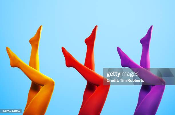 upside down legs with different colours - strumpfhose stock-fotos und bilder