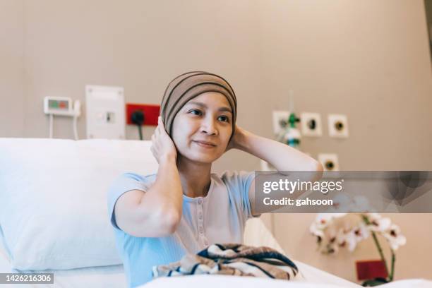 woman battling cancer in a hospital ward. - bright future stock pictures, royalty-free photos & images