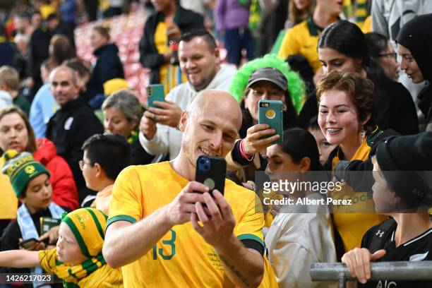 Aaron Mooy of Australia takes selfies with fans after the International Friendly match between the Australia Socceroos and the New Zealand All Whites...
