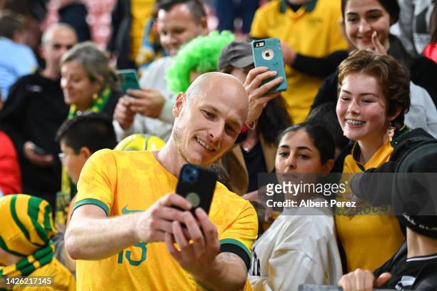 Aaron Mooy of Australia takes selfies with fans after the International Friendly match between the Australia Socceroos and the New Zealand All Whites...