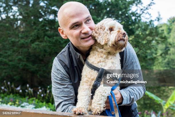 man and his dog - male feet on face stock pictures, royalty-free photos & images