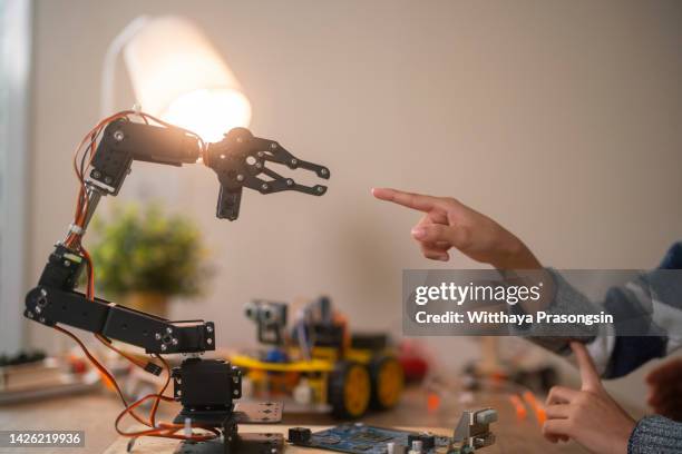 150 Robot Hand Reaching Out Stock Photos, High-Res Pictures, and Images ...