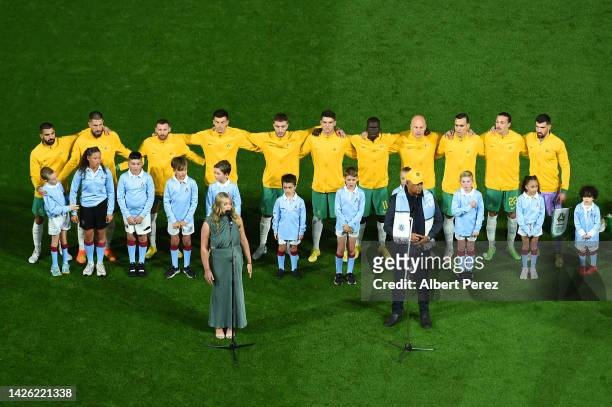 Australia sing the national anthem before the International Friendly match between the Australia Socceroos and the New Zealand All Whites at Suncorp...