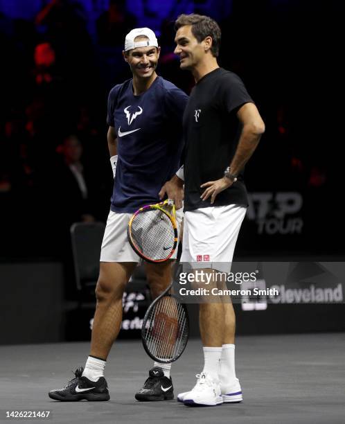 Rafael Nadal and Roger Federer of Team Europe talk during a practice session on centre court ahead of the Laver Cup at The O2 Arena on September 22,...
