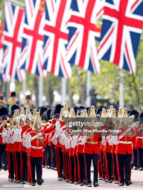 Dismounted detachment of The Life Guards of the Household Cavalry lead the ceremonial procession transporting Queen Elizabeth II's coffin, on a gun...