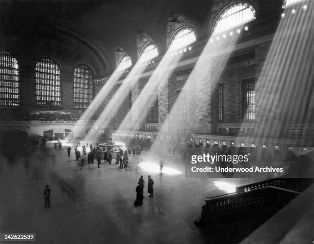 An interior shot of the Grand Central Railroad Station, with sunlight streaming in through the clerestory windows above, New York, New York, 1940s.