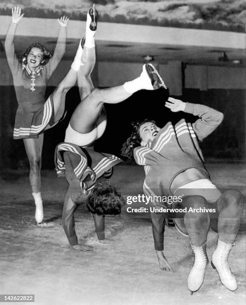 Bess Erhardt, Ice Follies star, does a forward flip on the ice as it is caught by the photographer in a triple exposure, San Francisco, California,...