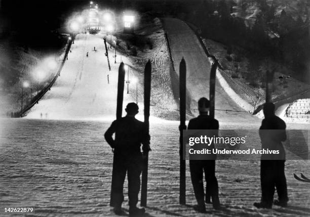 The winter stadium at Garmisch, Germany, site of the 1936 Winter Olympics, is illuminated at night for a ski-jump meet, Germisch, Germany, February...