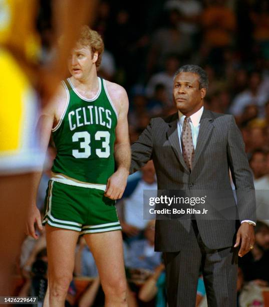 Boston Celtics Head Coach K.C. Jones comforts Larry Bird after altercation on court during 1985 NBA Finals between Los Angeles Lakers and Boston...