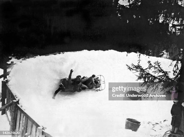 Bobsled takes at sharp curve on the giant bobsled run at Montana in the Valais, Montana, Valias, Switzerland, late 1930s.