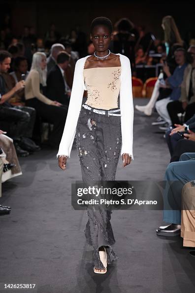 A model walks the runway of the MM6 Maison Margiela Fashion Show