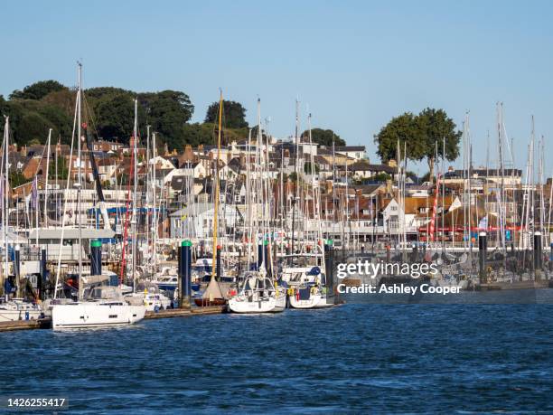 yachts in a marina in cowes on the isle of white, uk. - cowes stock pictures, royalty-free photos & images