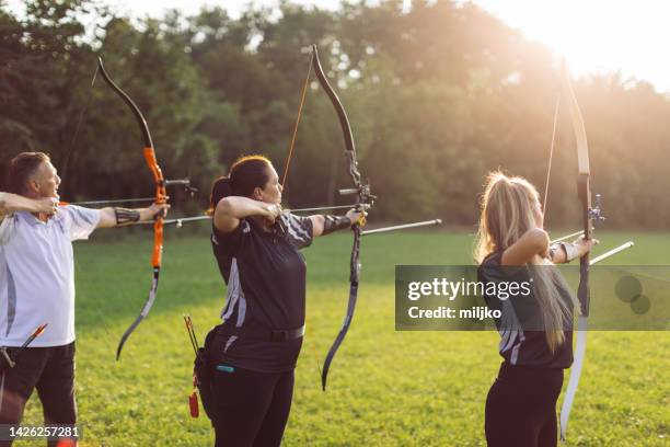 outdoors archery training - archery target stock pictures, royalty-free photos & images