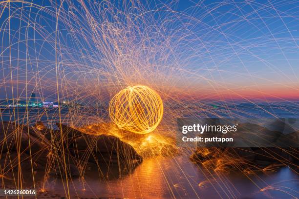 creative light painting by burning steelwool - open round one stock pictures, royalty-free photos & images