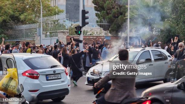 People gather in protest against the death of Mahsa Amini along the streets on September 19, 2022 in Tehran, Iran. 22-year-old Mahsa Amini fell into...