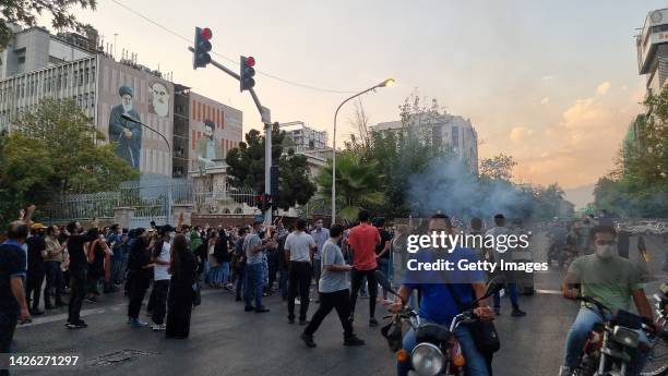 People gather in protest against the death of Mahsa Amini along the streets on September 19, 2022 in Tehran, Iran. 22-year-old Mahsa Amini fell into...