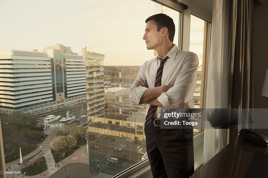 Businessman looking out windown