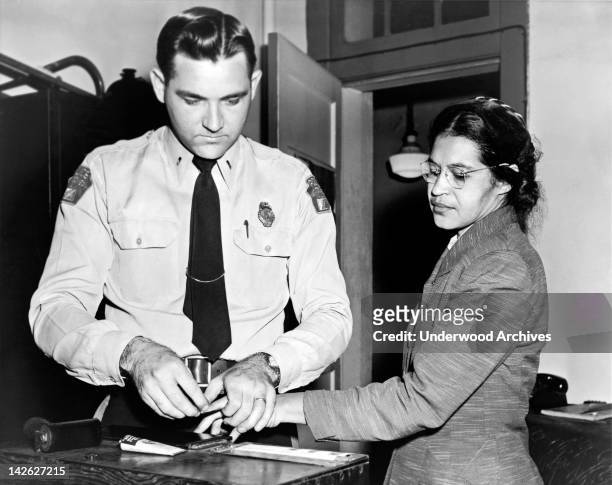 American civil rights activist, Rosa Parks , being fingerprinted after her refusal to move to the back of a bus to accommodate a white passenger...