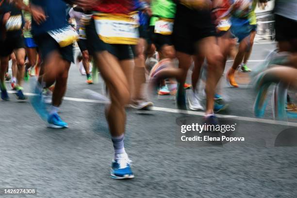 group of unknown people running marathon, defocused sports background - marathon bildbanksfoton och bilder