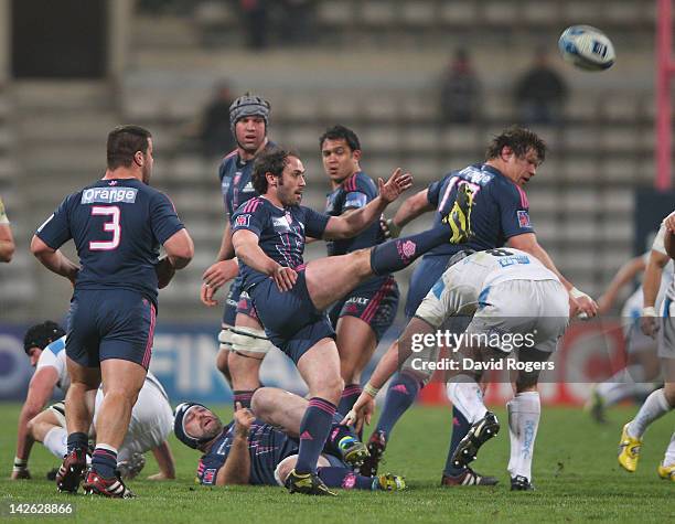 Julien Dupuy of Stade Francais kicks the ball upfield during the Amlin Challenge Cup quarter final match between Stade Francais and Exeter Chiefs at...