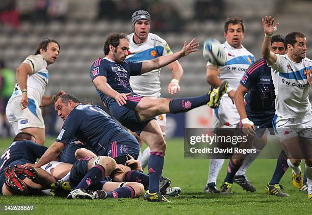 Julien Dupuy of Stade Francais kicks the ball upfield during the Amlin Challenge Cup quarter final match between Stade Francais and Exeter Chiefs at...