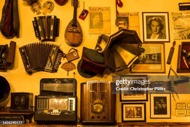 The lined walls of the "Cafe de Garcia", one of a number of well known and atmospheric old traditional cafes. Seen here a collection of photographs,...