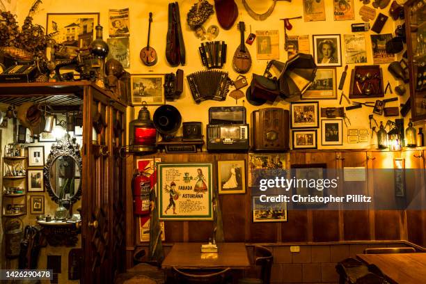 The lined walls of the "Cafe de Garcia", one of a number of well known and atmospheric old traditional cafes. Seen here a collection of photographs,...