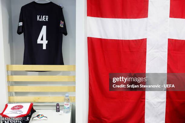 The kit of Simon Kjaer of Denmark is displayed inside the dressing room next to a Denmark flag prior to the UEFA Nations League League A Group 1...