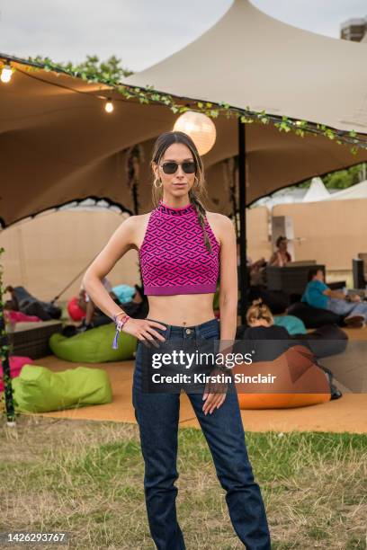 Isabella Charlotta Poppius wears Frame denim jeans, Versace top, Ray Ban sunglasses and a Valentino Rockstud bracelet at Victoria Park on August 26,...