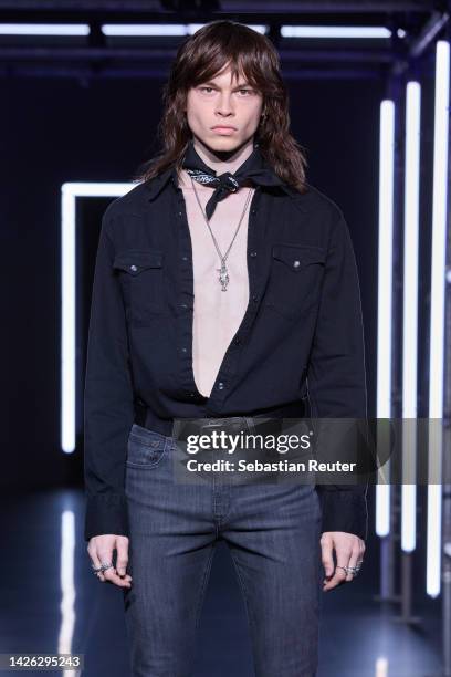 Model walks the runway at the Levi's show during the ABOUT YOU Fashion Week Milan 2022 at Zona Farini on September 22, 2022 in Milan, Italy.