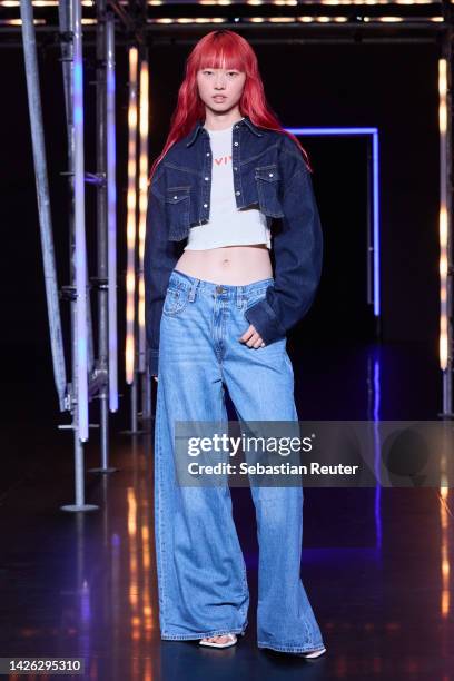 Model walks the runway at the Levi's show during the ABOUT YOU Fashion Week Milan 2022 at Zona Farini on September 22, 2022 in Milan, Italy.