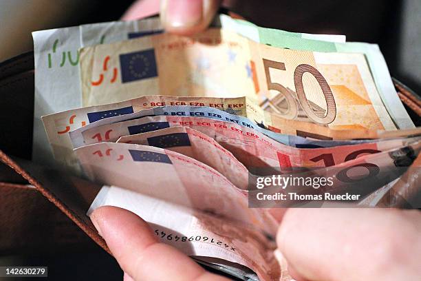 european money in a wallet - euro currency stock-fotos und bilder