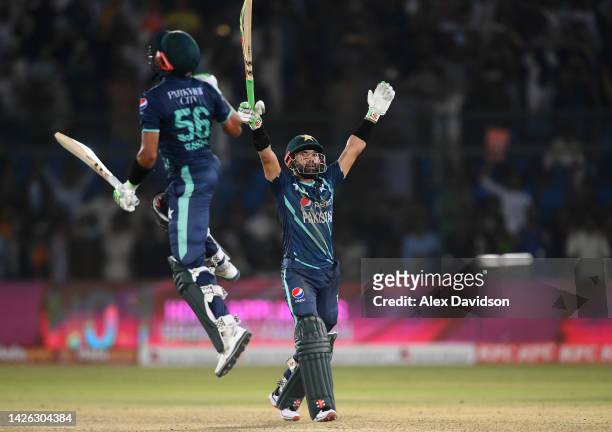 Mohammad Rizwan and Babar Azam of Pakistan celebrate victory during the 2nd IT20 match between Pakistan and England on September 22, 2022 in Karachi,...