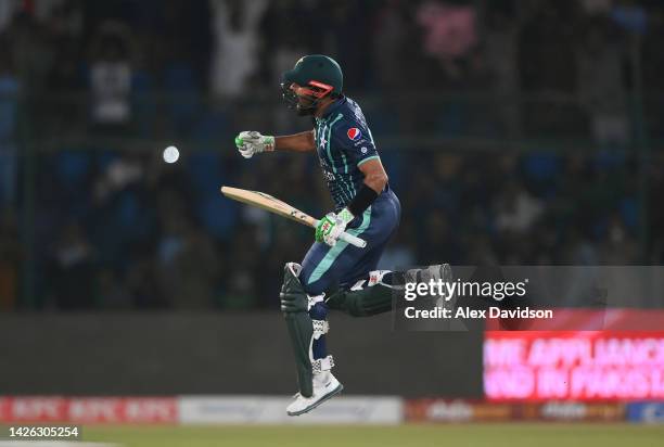 Babar Azam of Pakistan celebrates reaching his century during the 2nd IT20 match between Pakistan and England on September 22, 2022 in Karachi,...