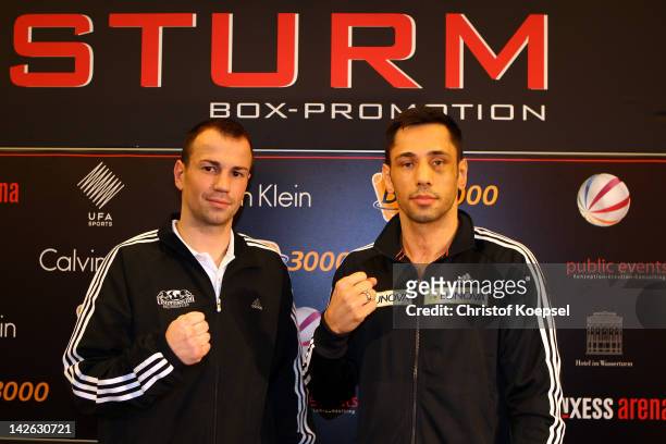 Sebastian Zbik and Felix Sturm poses after the press conference at Hotel im Wasserturm on April 10, 2012 in Cologne, Germany. The WBA World...
