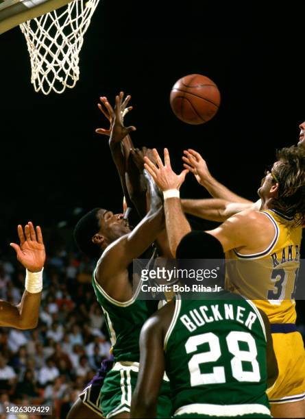 Celtics Robert Parish battles Lakers Kurt Rambis for rebound during 1985 NBA Finals between Los Angeles Lakers and Boston Celtics, June 4, 1985 in...