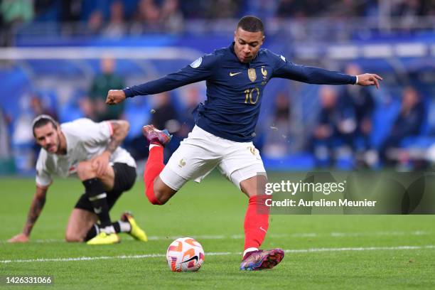 Kylian Mbappe of France scores their side's first goal during the UEFA Nations League League A Group 1 match between France and Austria at Stade de...