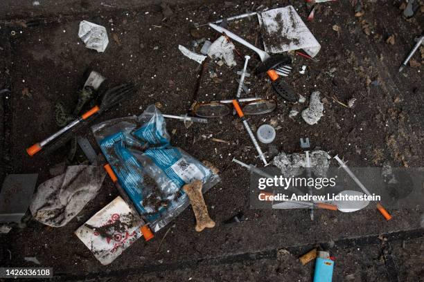 Used needles are seen on the street during a city sweep of a homeless encampment, September 22, 2022 in New York City, New York.