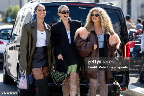 Sarah Lysander wearing Prada skirt and white tank top, leather green jacket and Prada bag, Leonie Hanne wearing a Prada white tank top and green...