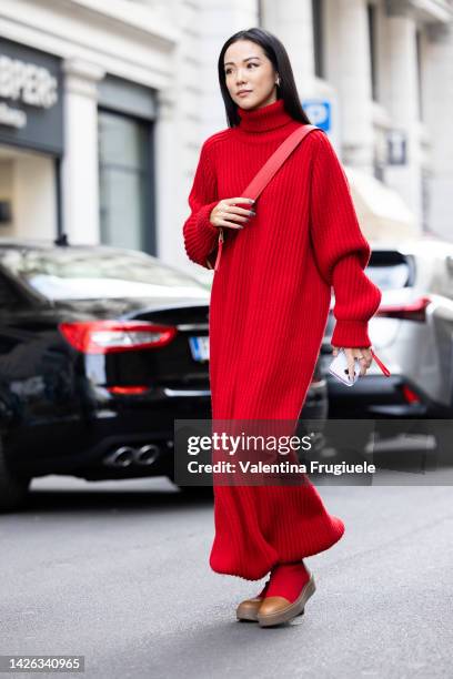 Yoyo Cao is seen wearing a red jumper dress outside Max Mara show during the Milan Fashion Week - Womenswear Spring/Summer 2023 on September 22, 2022...