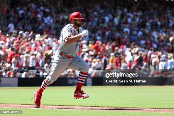 Albert Pujols of the St. Louis Cardinals runs to first base after hitting a single during the secondinning of a game against the San Diego Padres at...