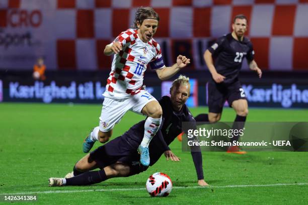 Luka Modric of Croatia is challenged by Simon Kjaer of Denmark during the UEFA Nations League League A Group 1 match between Croatia and Denmark at...
